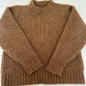 Fits like M/L. 
The Naya Sweater by Ozma of CA